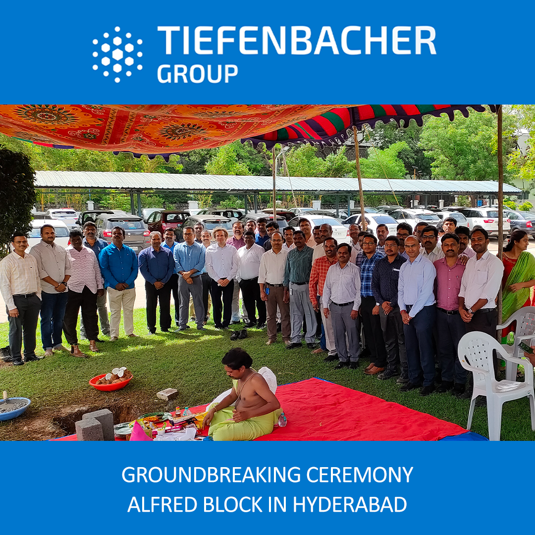 Tiefenbacher Group - A large group gathers outdoors under a colorful canopy for a groundbreaking ceremony as a priest leads rituals. Highlighting Tiefenbacher Group’s family-owned pharmaceutical company and patient-centric drug development, event details frame the image.