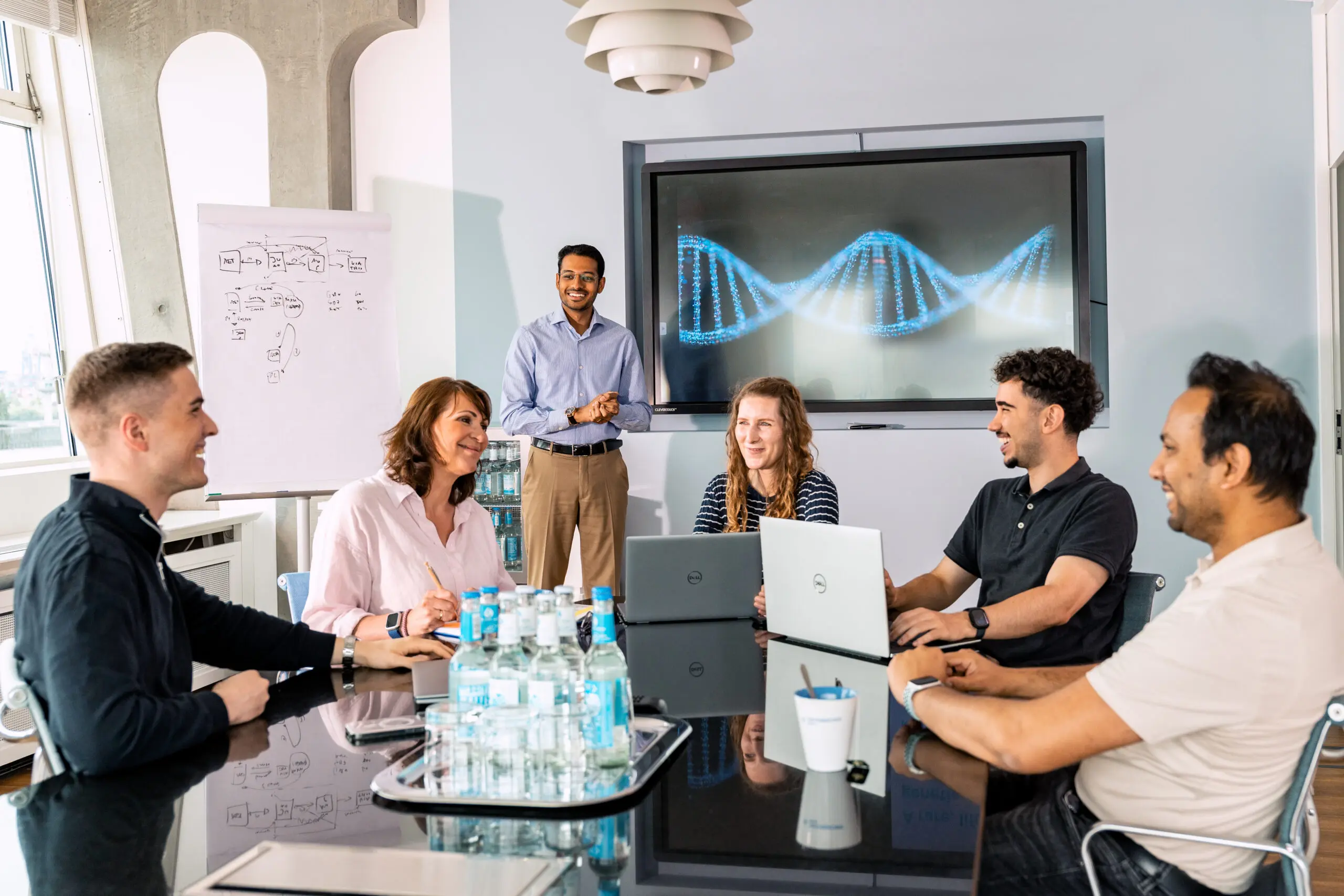 People sit around a table in a Meeting Room