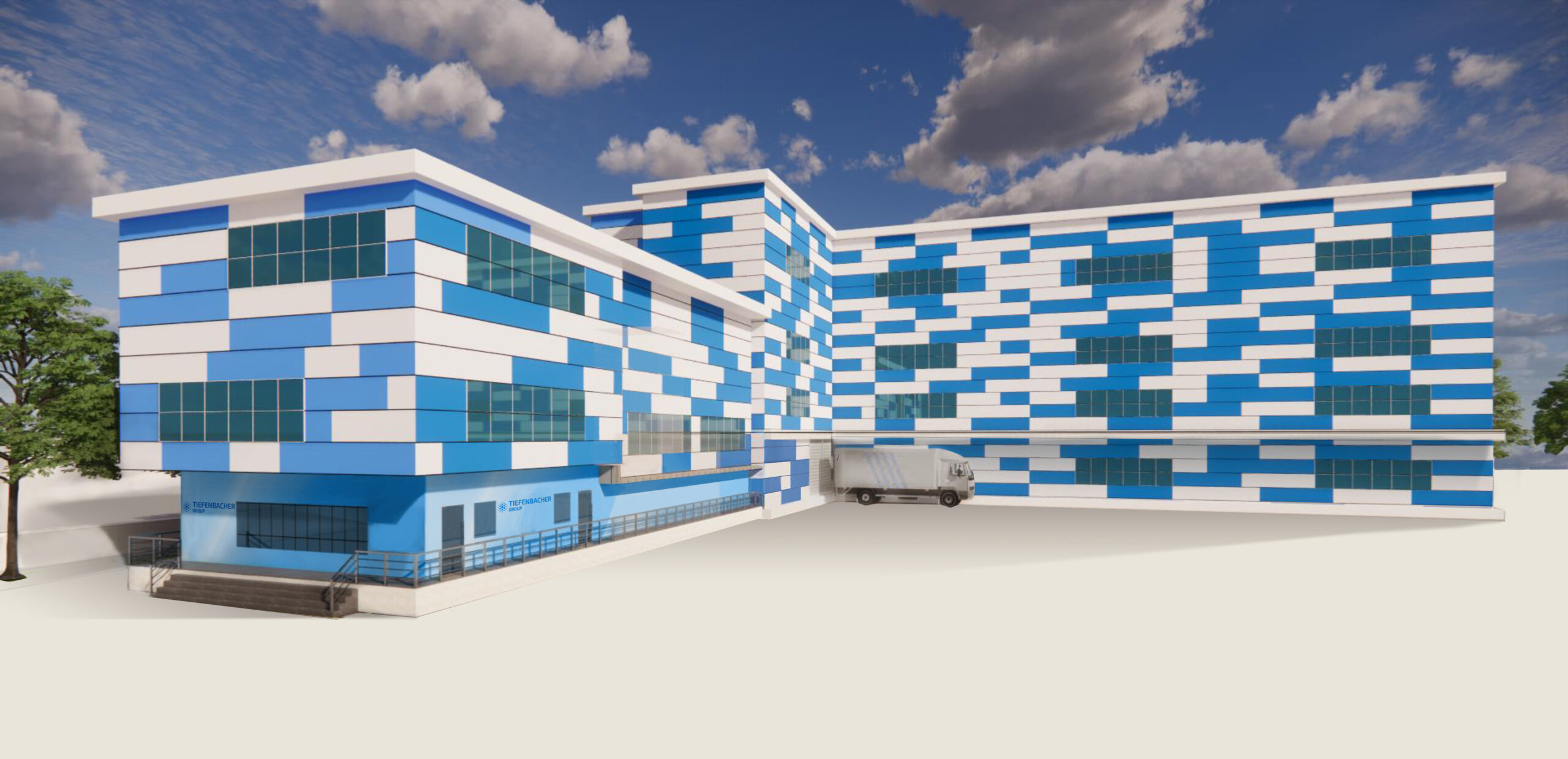 Tiefenbacher Group - A modern building with a blue and white geometric facade, large glass windows, and a loading dock where a truck is parked; ideal for API distribution of finished dosage forms, with a partly cloudy sky above.