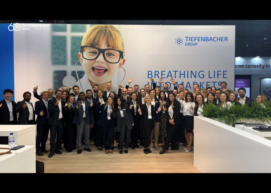 Tiefenbacher Group - A group of people posing for a photo, representing excellence in pharmaceutical healthcare solutions.
